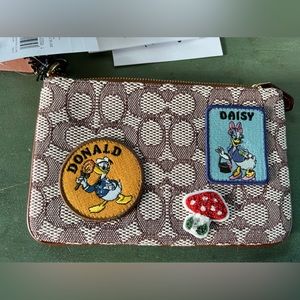 Daisy and Donald Coach wristlet